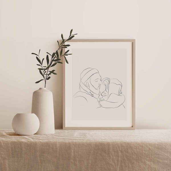 Dibujo Line Art de una pareja, en un marco sobre una mesa junto a una planta